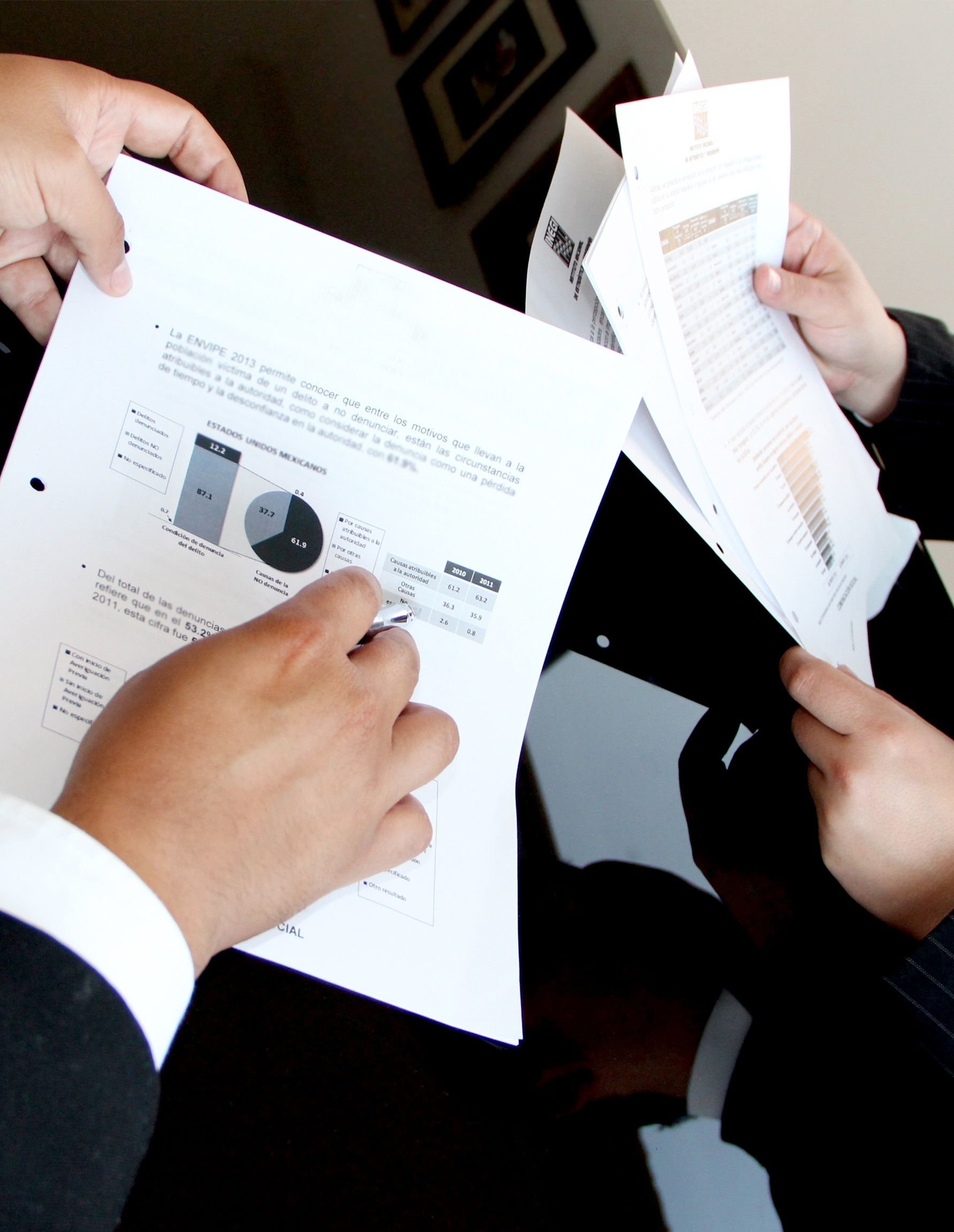 Corporate team reviewing business documents